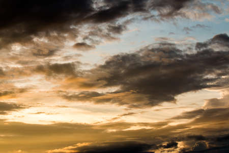 colorful dramatic sky with cloud at sunsetの写真素材