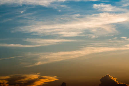 colorful dramatic sky with cloud at sunsetの写真素材