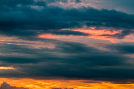 colorful dramatic sky with cloud at sunsetの写真素材