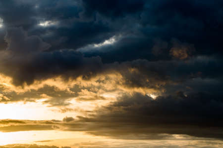 colorful dramatic sky with cloud at sunsetの写真素材