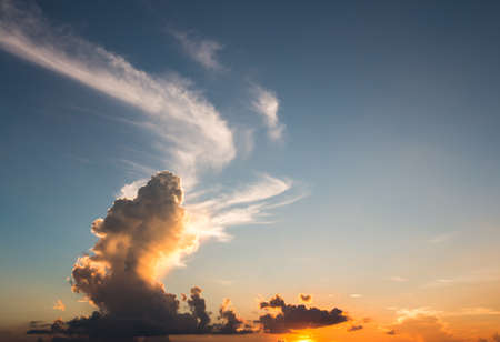 colorful dramatic sky with cloud at sunsetの写真素材