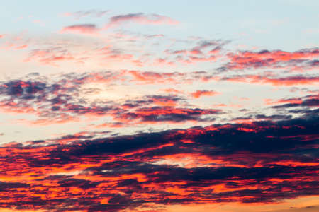 colorful dramatic sky with cloud at sunsetの写真素材