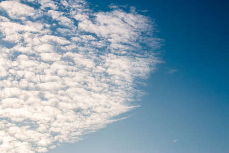 colorful dramatic sky with cloud at sunsetの写真素材