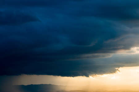 colorful dramatic sky with cloud at sunsetの写真素材