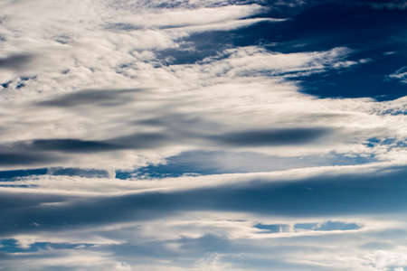 colorful dramatic sky with cloud at sunsetの写真素材