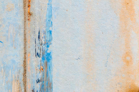 A background of peeling paint and rusty old metal