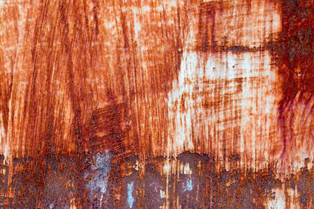 A background of peeling paint and rusty old metal