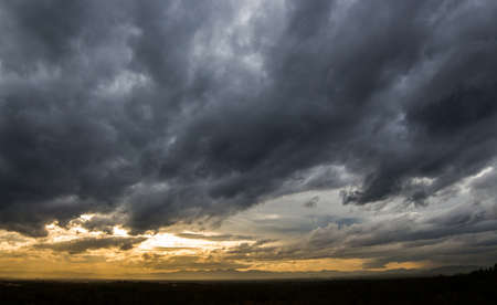 colorful dramatic sky with cloud at sunsetの写真素材