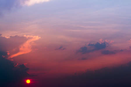 colorful dramatic sky with cloud at sunsetの写真素材