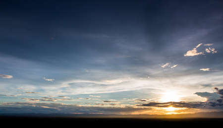 colorful dramatic sky with cloud at sunsetの写真素材