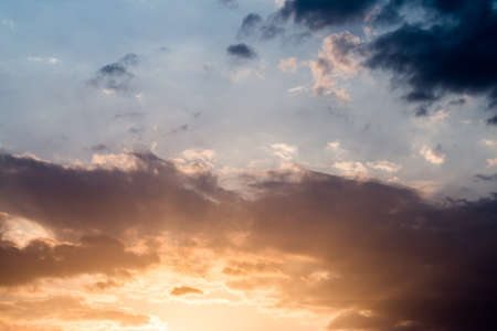 colorful dramatic sky with cloud at sunsetの写真素材