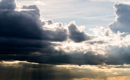 colorful dramatic sky with cloud at sunsetの写真素材