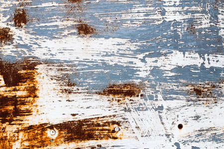 A background of peeling paint and rusty old metal