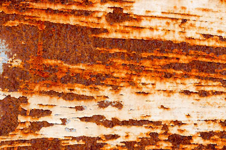 A background of peeling paint and rusty old metal
