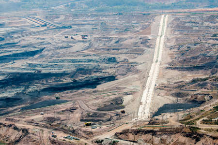 Part of a pit with big mining truck working