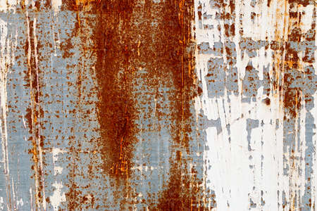 A background of peeling paint and rusty old metal