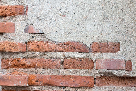 cracked concrete vintage brick wall backgroundの写真素材