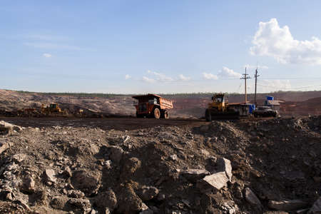Part of a pit with big mining truck working