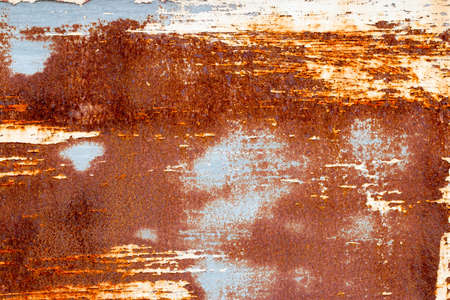 A background of peeling paint and rusty old metal