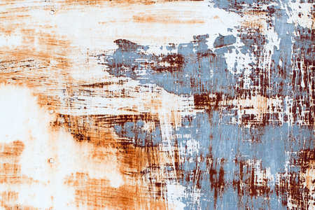 A background of peeling paint and rusty old metalの写真素材