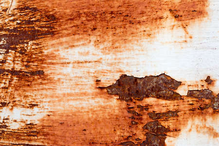 A background of peeling paint and rusty old metal