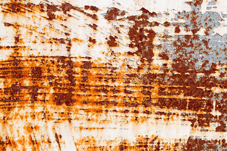 A background of peeling paint and rusty old metal