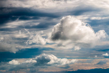 colorful dramatic sky with cloud at sunsetの写真素材