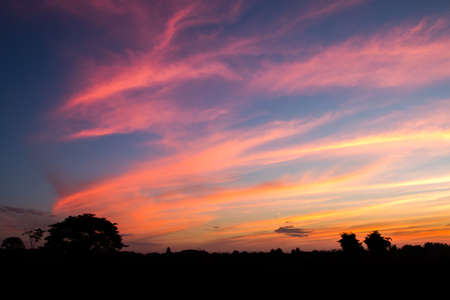 colorful dramatic sky with cloud at sunsetの写真素材