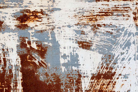 a background of peeling paint and rusty old metal