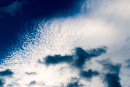 colorful dramatic sky with cloud at sunsetの写真素材