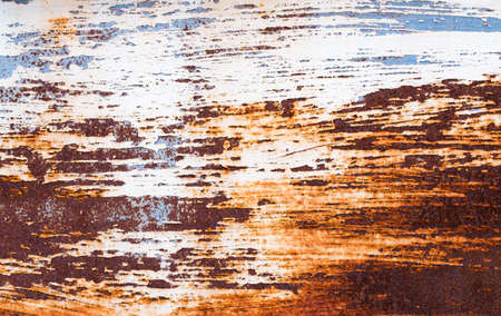 A background of peeling paint and rusty old metalの写真素材