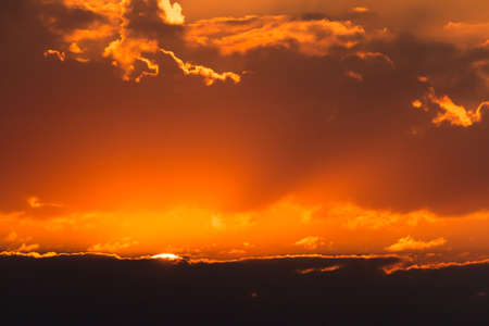 colorful dramatic sky with cloud at sunsetの写真素材
