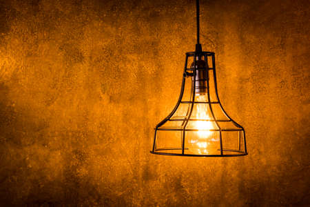 Decorative antique edison style light bulbs against brick wall backgroundの写真素材