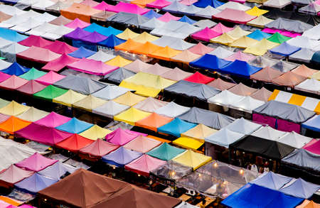 Colorful food stalls at Rod Fai Night Market in Bangkok