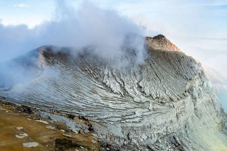Lake and Sulfur Mine at Khawa Ijen Volcano Crater, Java Island, Indonesiaの写真素材