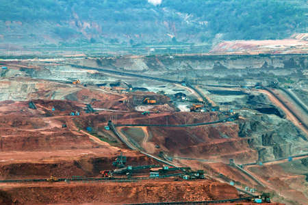Part of a pit with big mining truck working