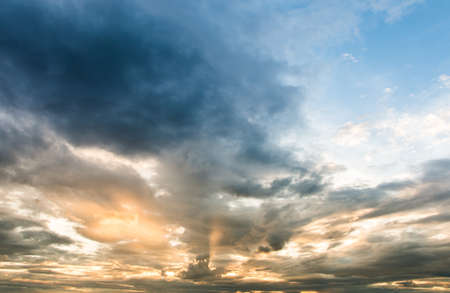 colorful dramatic sky with cloud at sunsetの写真素材