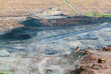 Part of a pit with big mining truck workingのeditorial素材