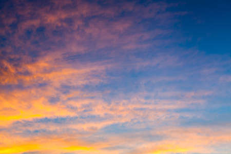 colorful dramatic sky with cloud at sunset.