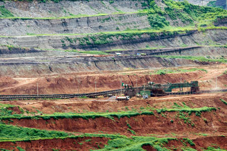 Part of a pit with big mining truck working