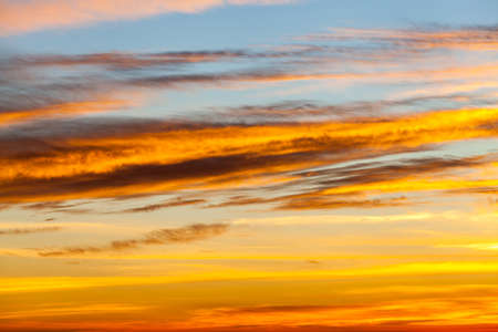 colorful dramatic sky with cloud at sunset.