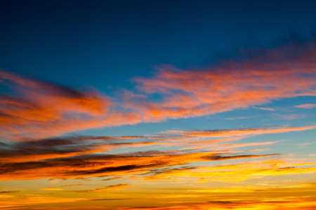 colorful dramatic sky with cloud at sunset.