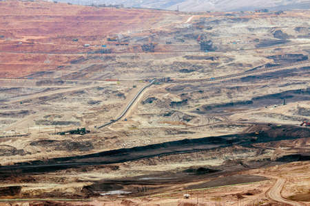 Part of a pit with big mining truck working