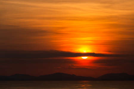 colorful dramatic sky with cloud at sunset.の写真素材