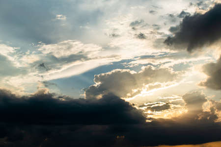 colorful dramatic sky with cloud at sunset.の写真素材