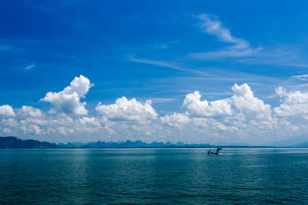 Clear water and blue sky. Beach in Krabi province, Thailand.
