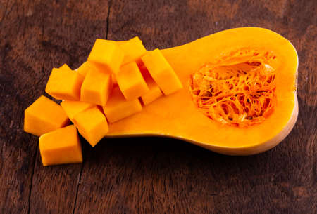 butternut squash over old wood backgroundの写真素材