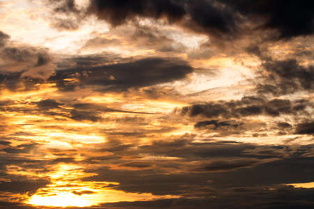 colorful dramatic sky with cloud at sunset.