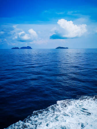 Blue Seawater with sea foam as backgroundの写真素材