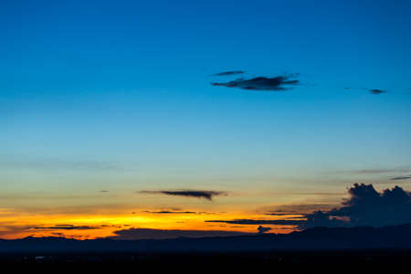 colorful dramatic sky with cloud at sunset.の写真素材